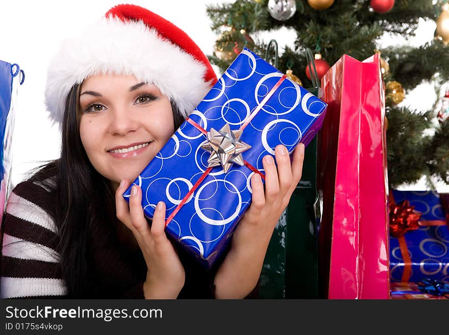 Happy brunette woman over christmas tree. Happy brunette woman over christmas tree