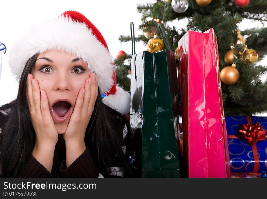 Happy brunette woman over christmas tree. Happy brunette woman over christmas tree