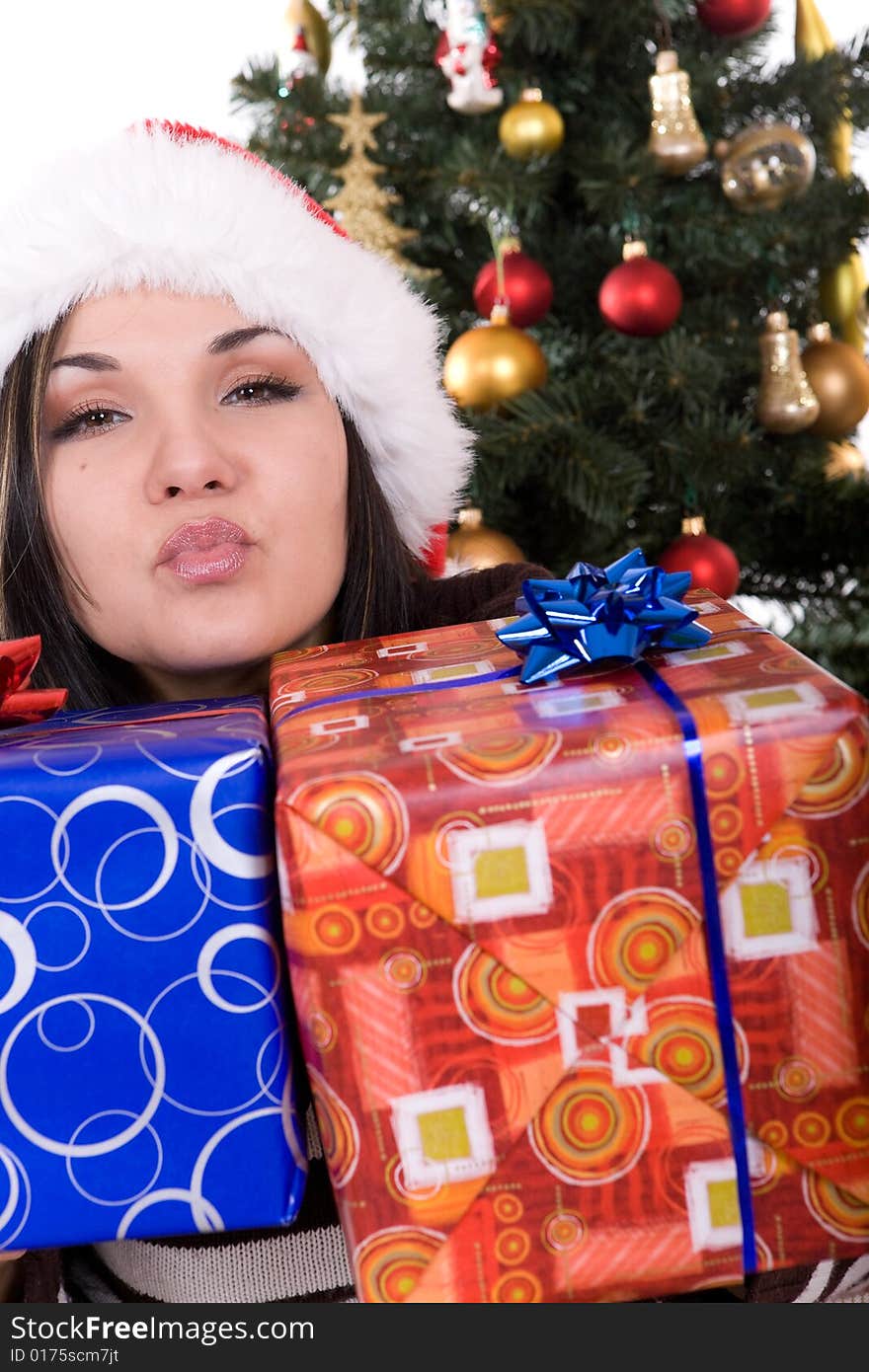 Happy brunette woman over christmas tree. Happy brunette woman over christmas tree