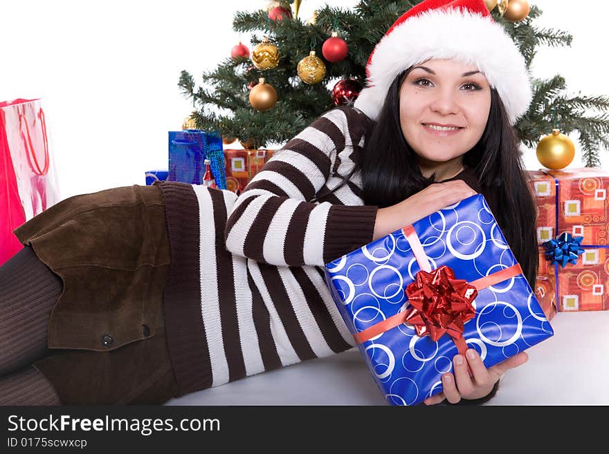 Happy brunette woman over christmas tree. Happy brunette woman over christmas tree