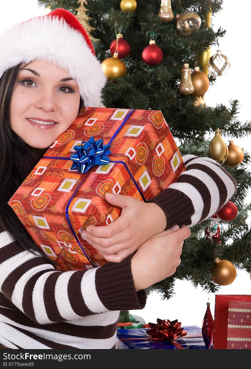 Happy brunette woman over christmas tree. Happy brunette woman over christmas tree