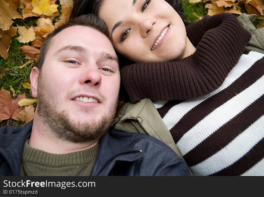 Happy couple together playing in park