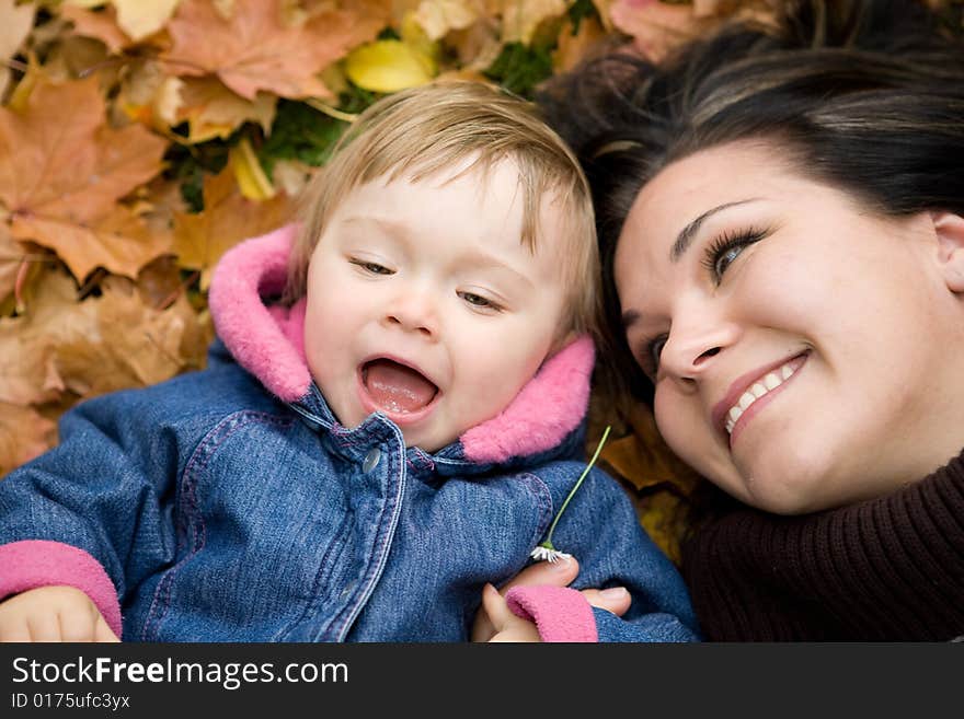 Mother and daughter playing in park. Mother and daughter playing in park