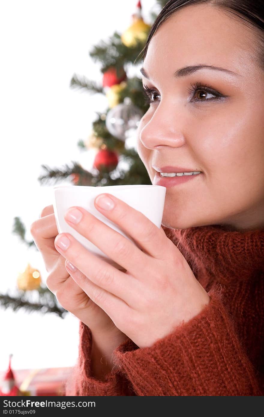 Happy brunette woman over christmas tree. Happy brunette woman over christmas tree