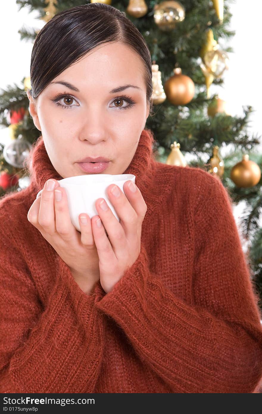 Happy brunette woman over christmas tree. Happy brunette woman over christmas tree