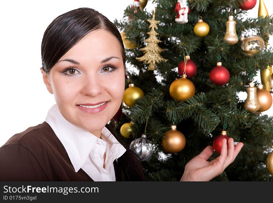 Happy brunette woman over christmas tree. Happy brunette woman over christmas tree