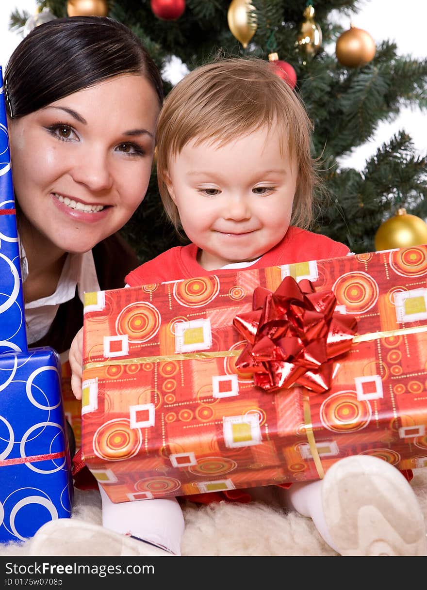 Happy mother and daughter over christmas tree. Happy mother and daughter over christmas tree