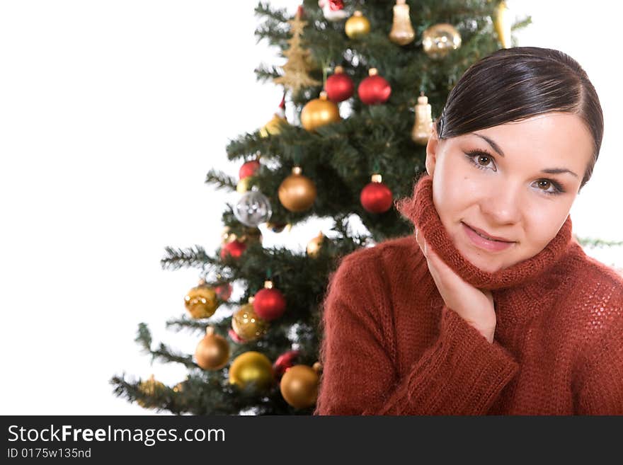 Happy brunette woman over christmas tree. Happy brunette woman over christmas tree