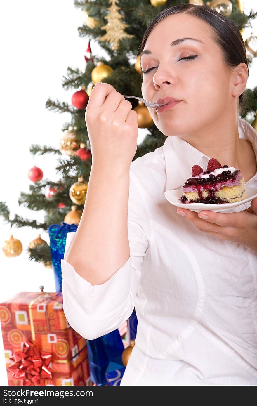 Happy brunette woman over christmas tree. Happy brunette woman over christmas tree