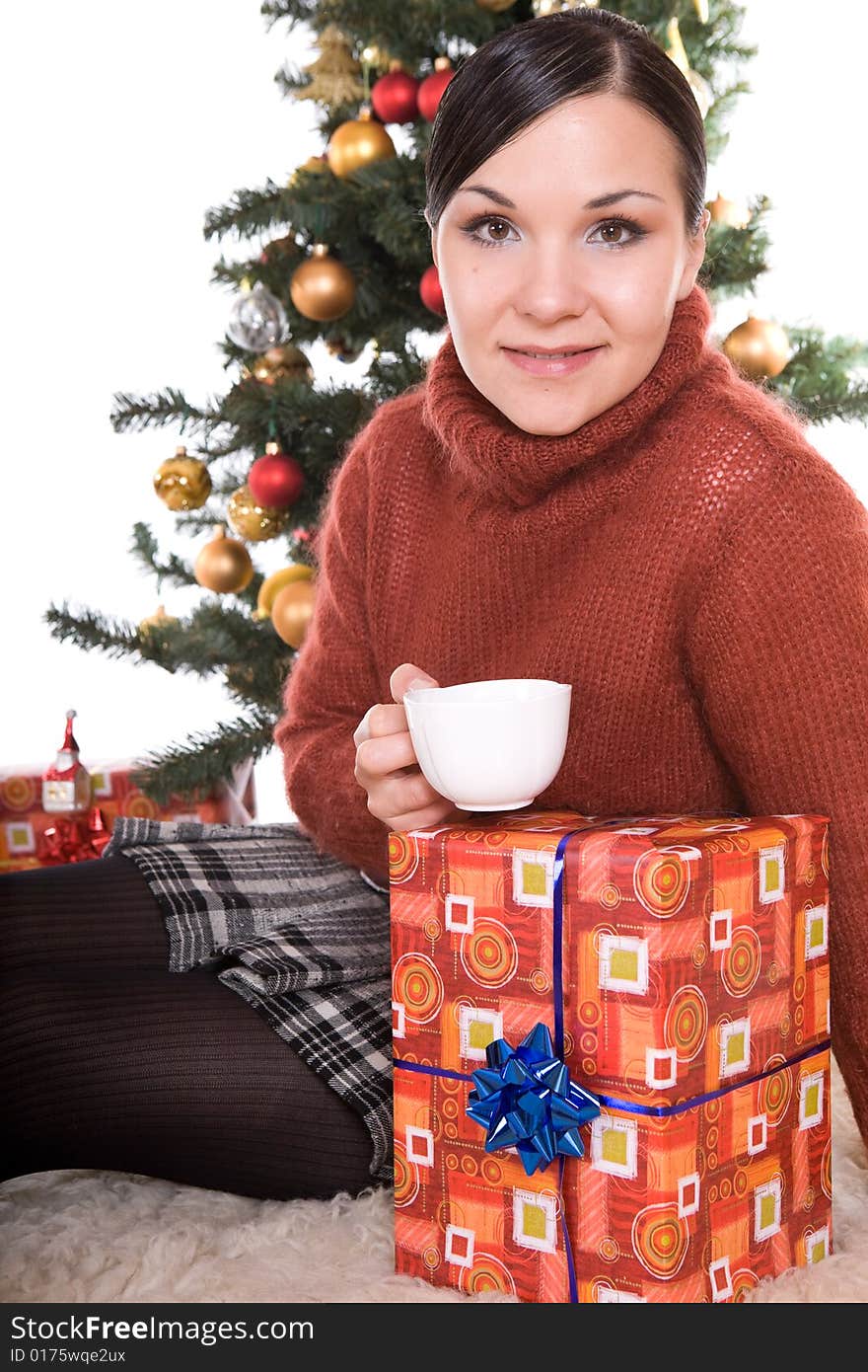 Happy brunette woman over christmas tree. Happy brunette woman over christmas tree