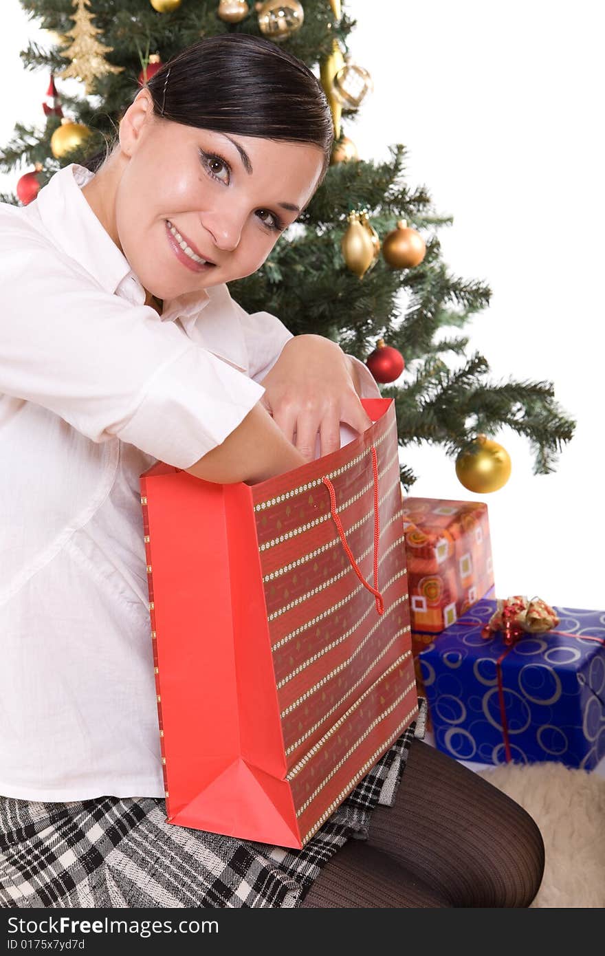 Happy brunette woman over christmas tree. Happy brunette woman over christmas tree