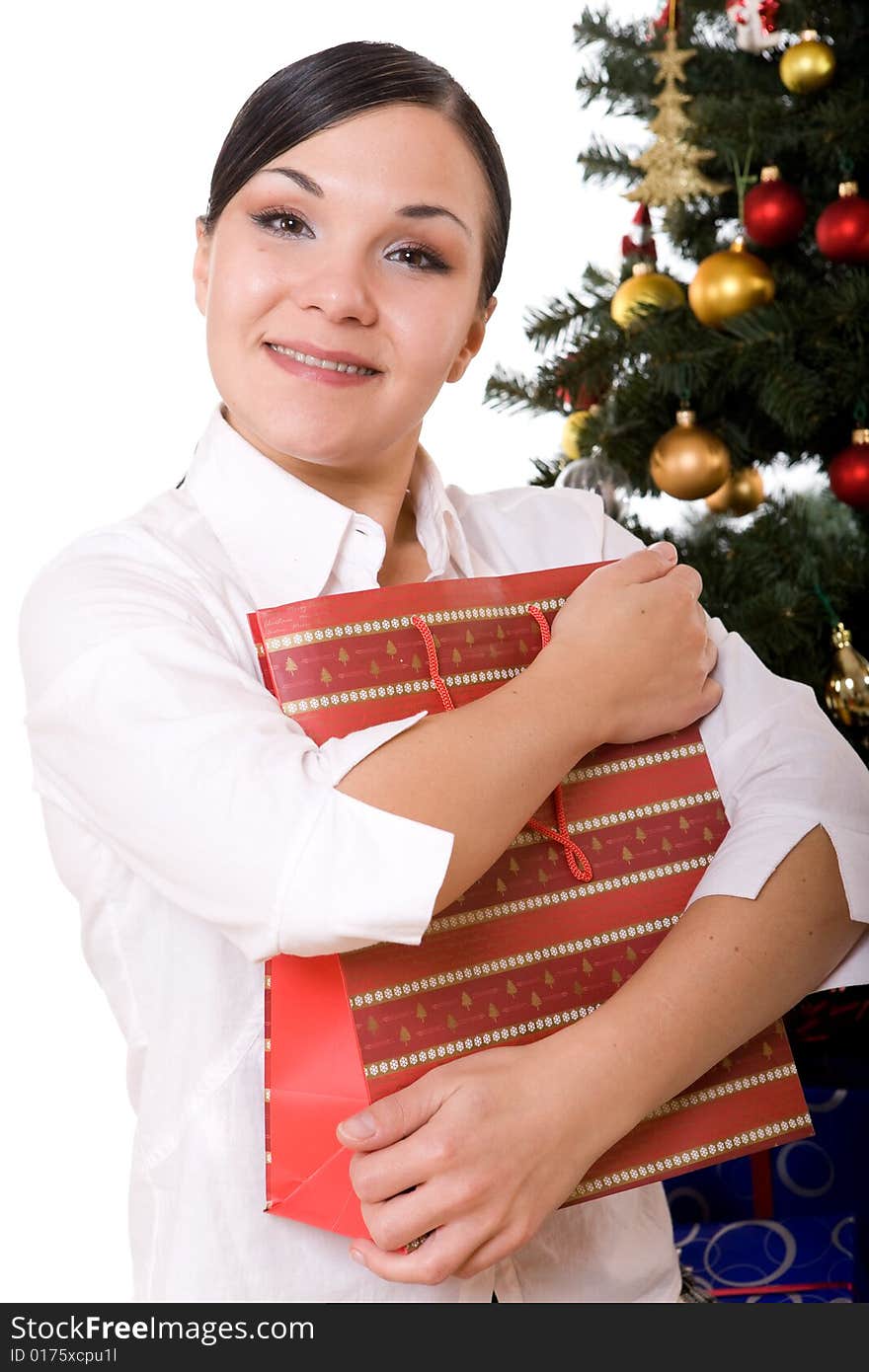 Happy brunette woman over christmas tree. Happy brunette woman over christmas tree