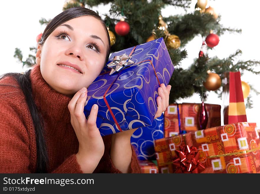 Happy brunette woman over christmas tree. Happy brunette woman over christmas tree