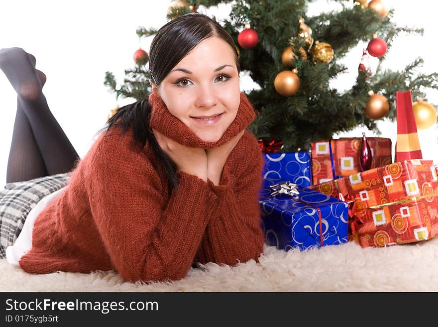 Happy brunette woman over christmas tree. Happy brunette woman over christmas tree