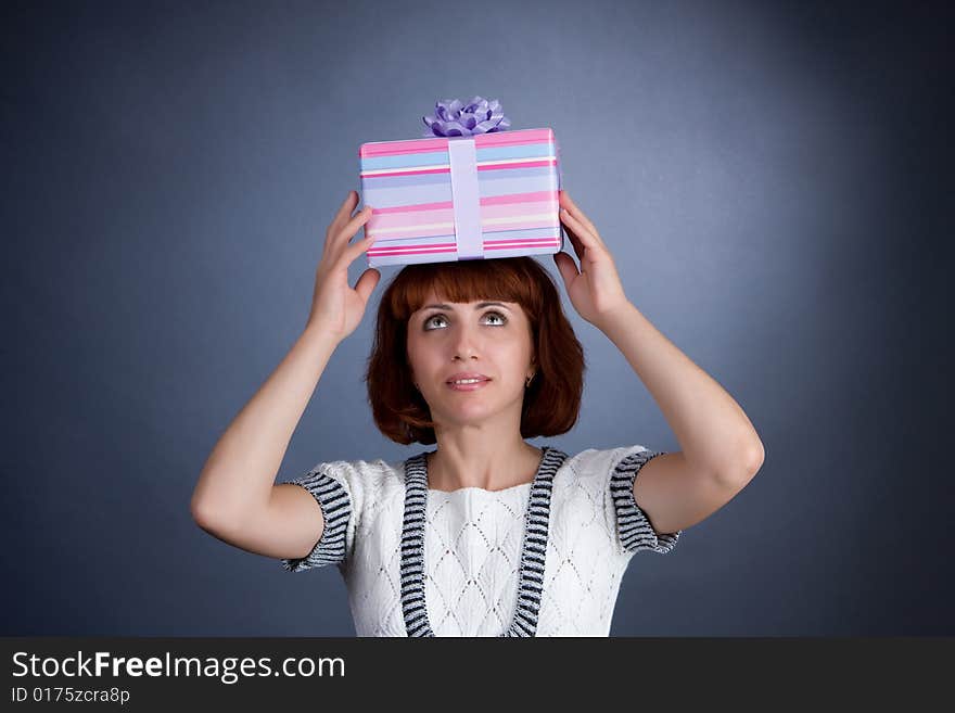 The beautiful Girl with a box of gifts. The beautiful Girl with a box of gifts.