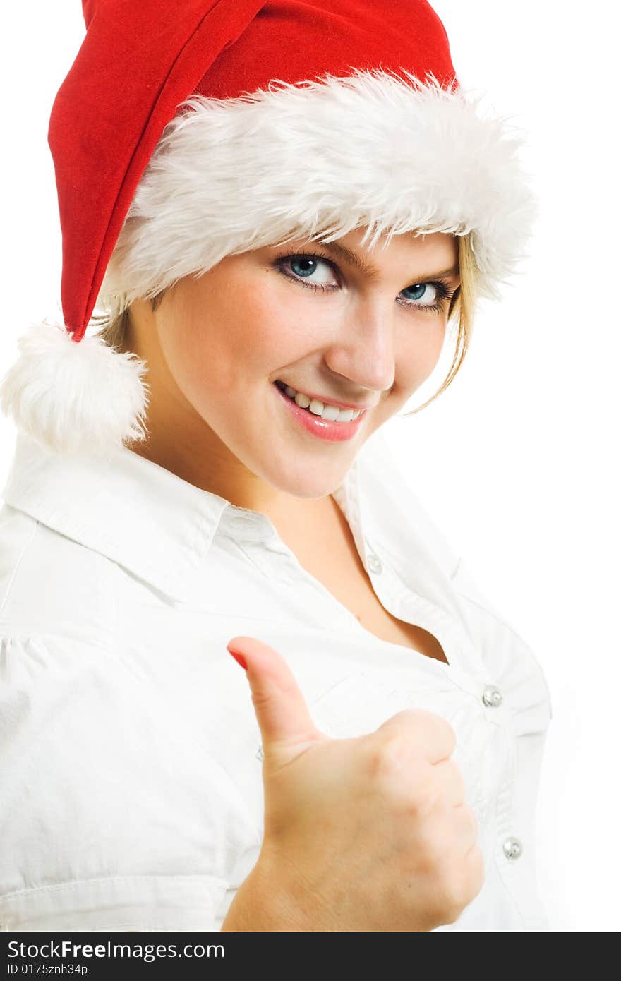 Girl in Santa hat showing thumbs up. Girl in Santa hat showing thumbs up.