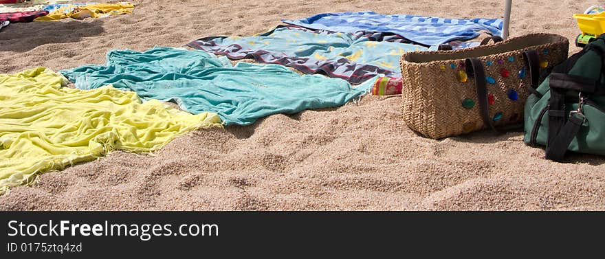 Closeup of Towels in the beach with casual bag.