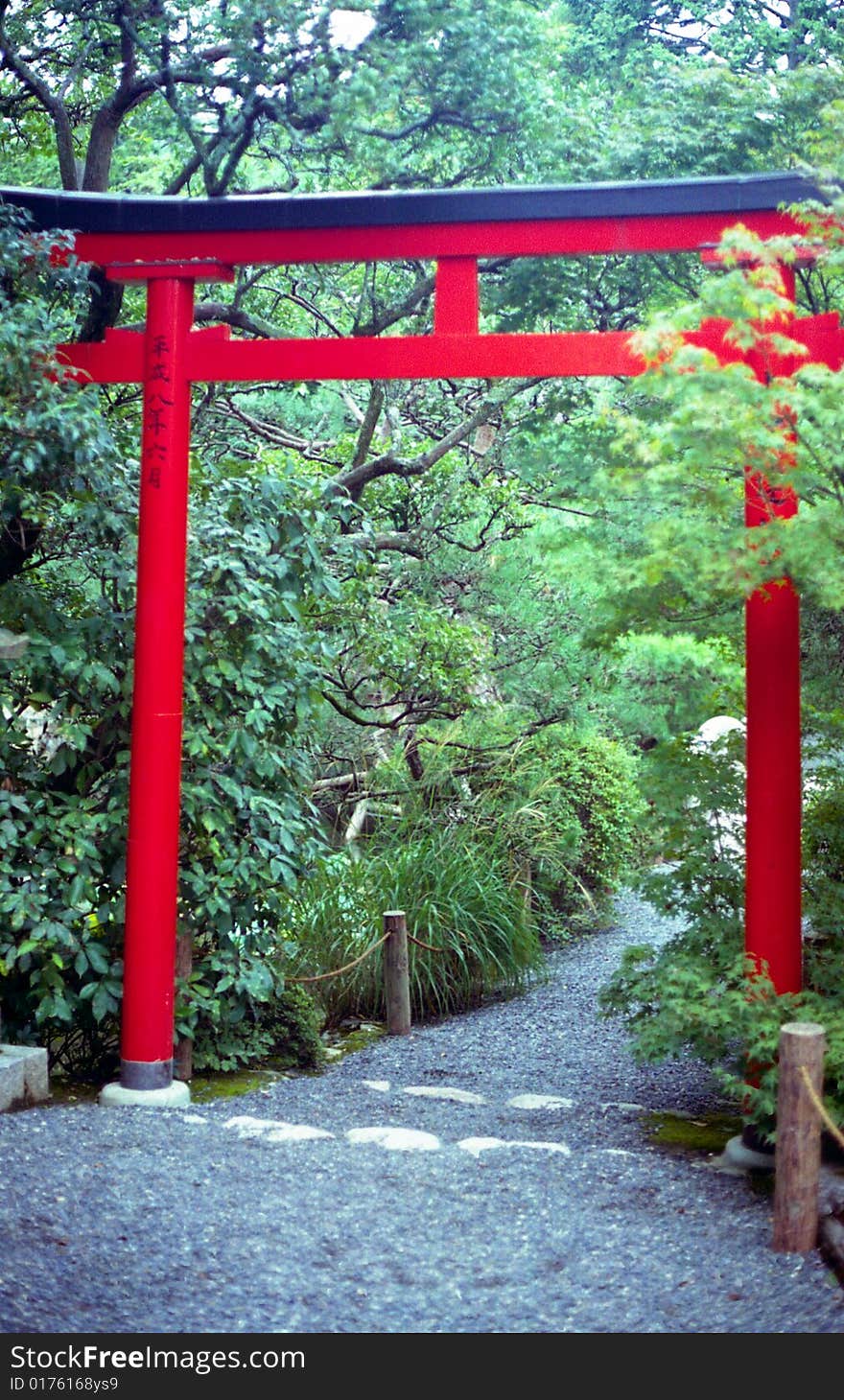 Torii gate in Japanese garden at Ryoanji Temple in Kyoto