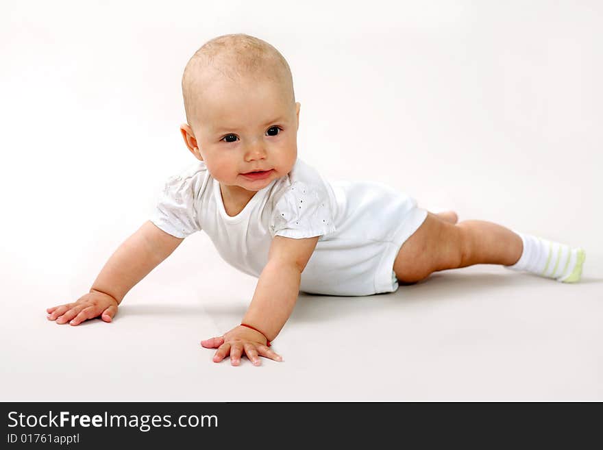 An image of a little baby crawning in studio