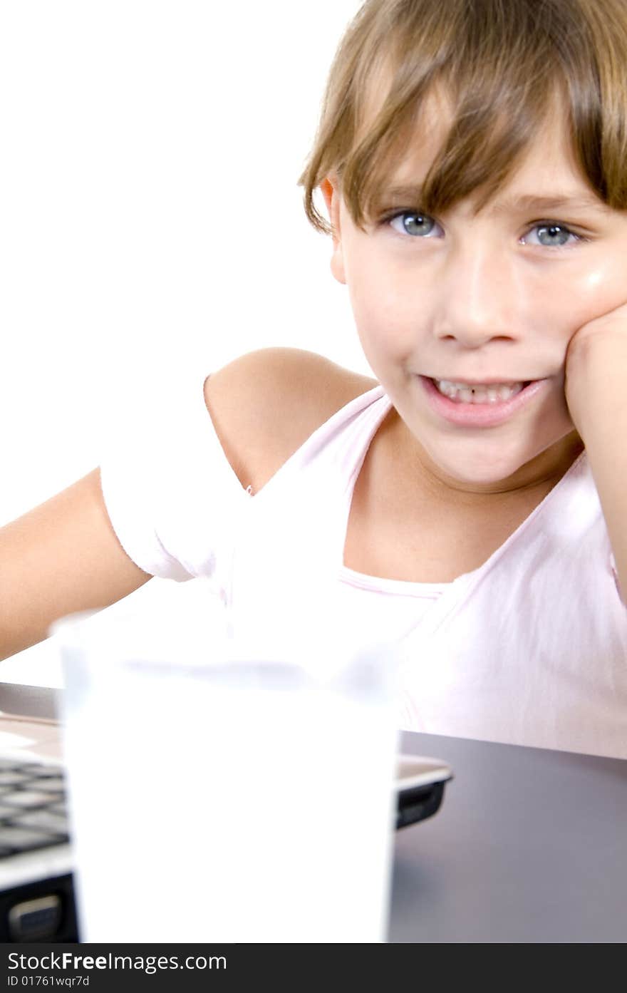 Healthy girl with milk and laptop on an isolated background