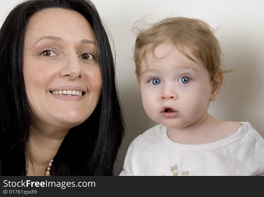 Mother and child looking to camera