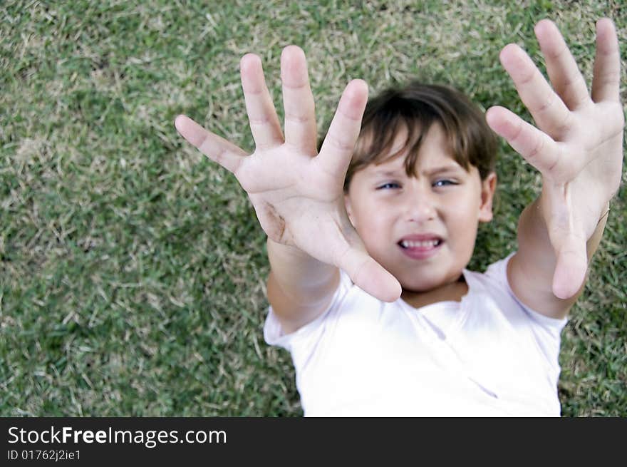 Cute girl showing her palms to camera