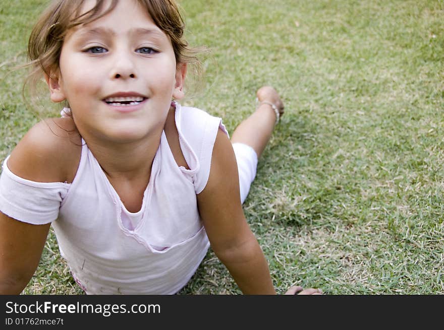 Pretty young girl playing in the garden