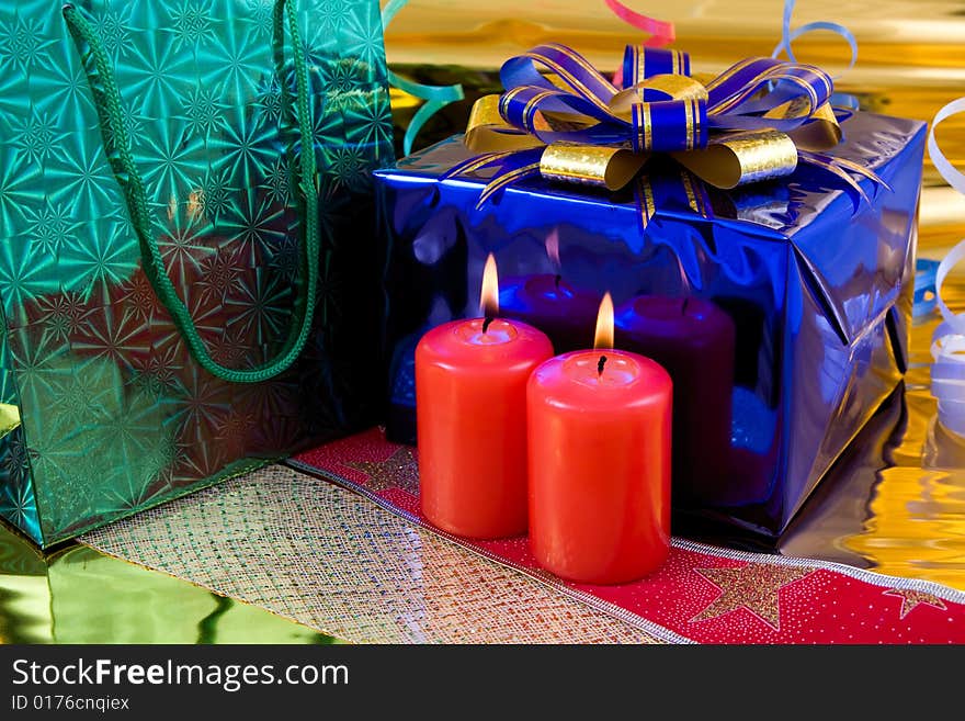 Gift box and burning candles