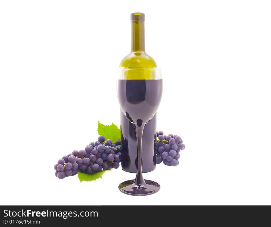 Bottle, glass and a cluster of grapes. Bottle, glass and a cluster of grapes