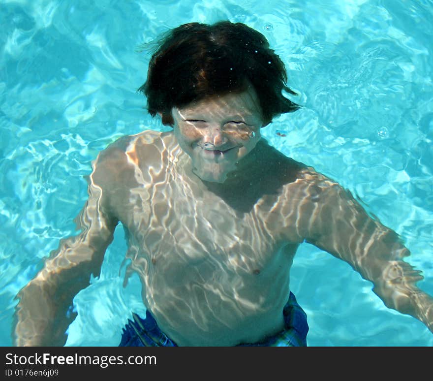 Image of boy smiling underwater. Image of boy smiling underwater