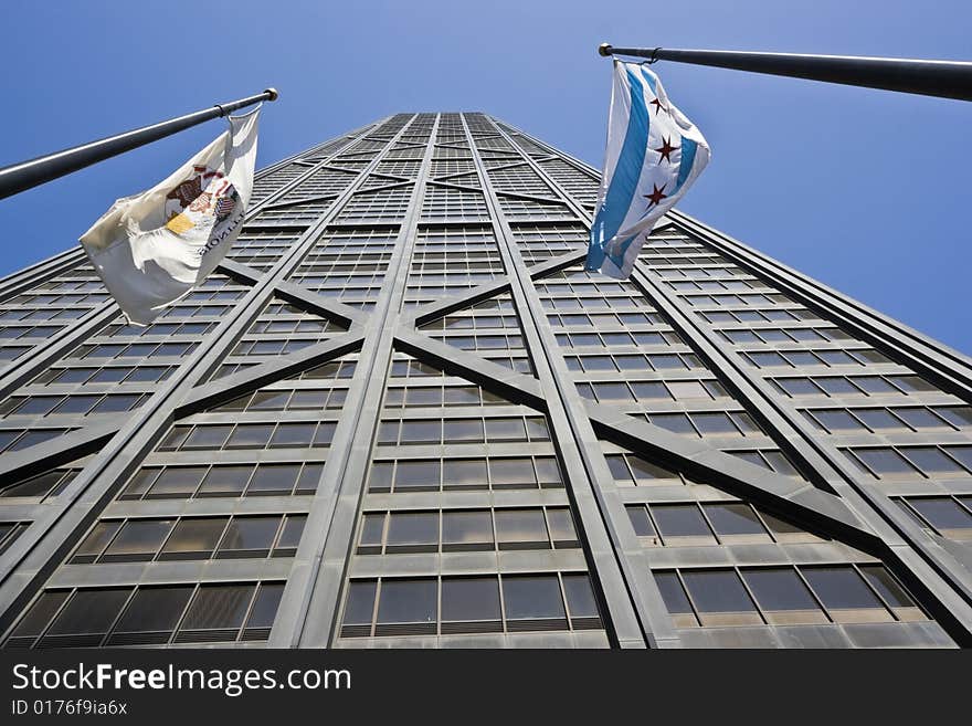 Hancock Tower and flags of Illinois and Chicago