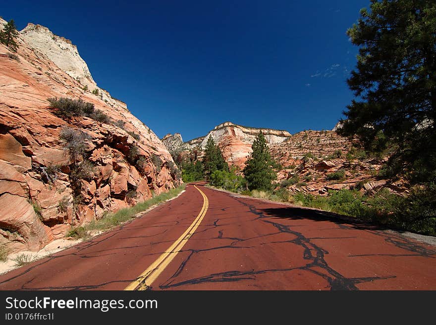 Scenic red highway leading through Zion National Park area