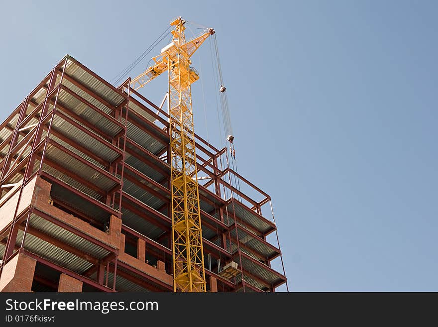 Construction, new office building and crane.