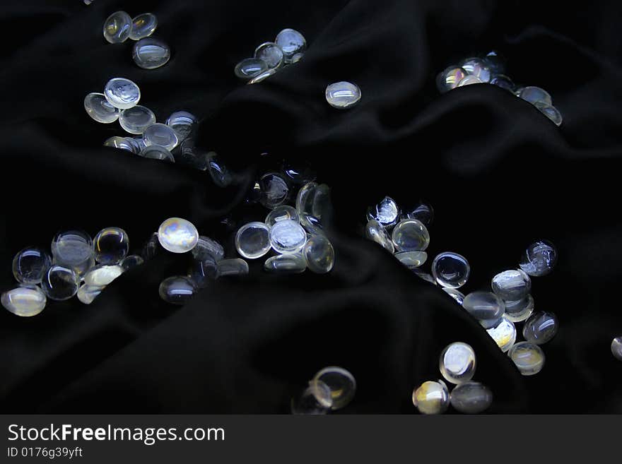 Glass balls on black silk