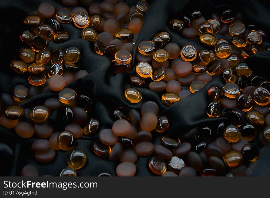 Glass balls on black silk