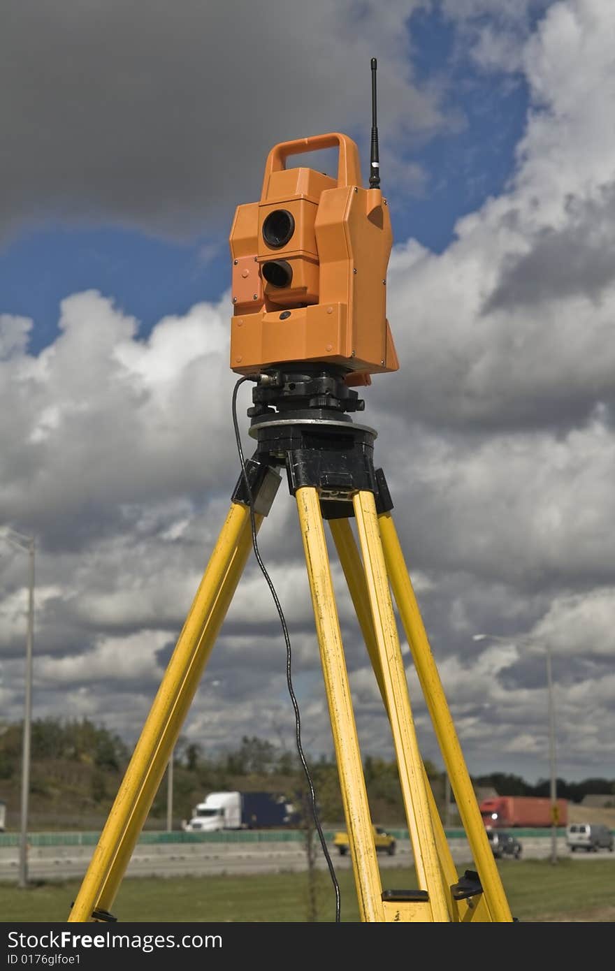 Surveying highway - insturment set on the side of the road.