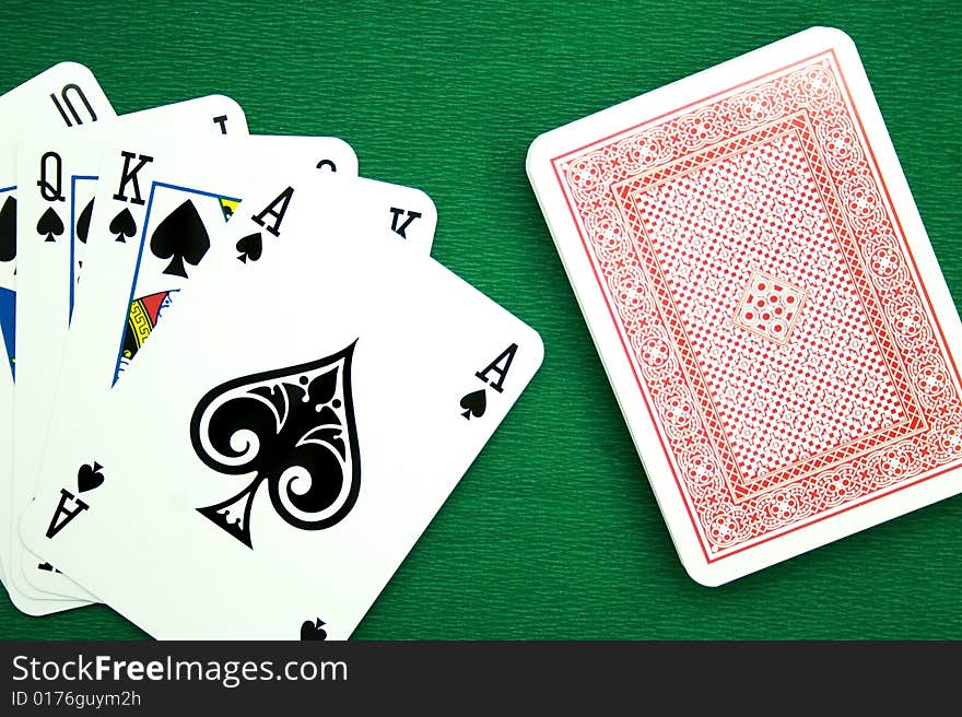 Playing cards on a green background