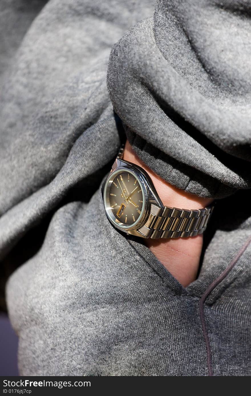 Relaxation concept. Hand with wrist-watch into a pocket. Relaxation concept. Hand with wrist-watch into a pocket