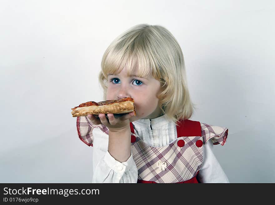 Girl eating pizza slice