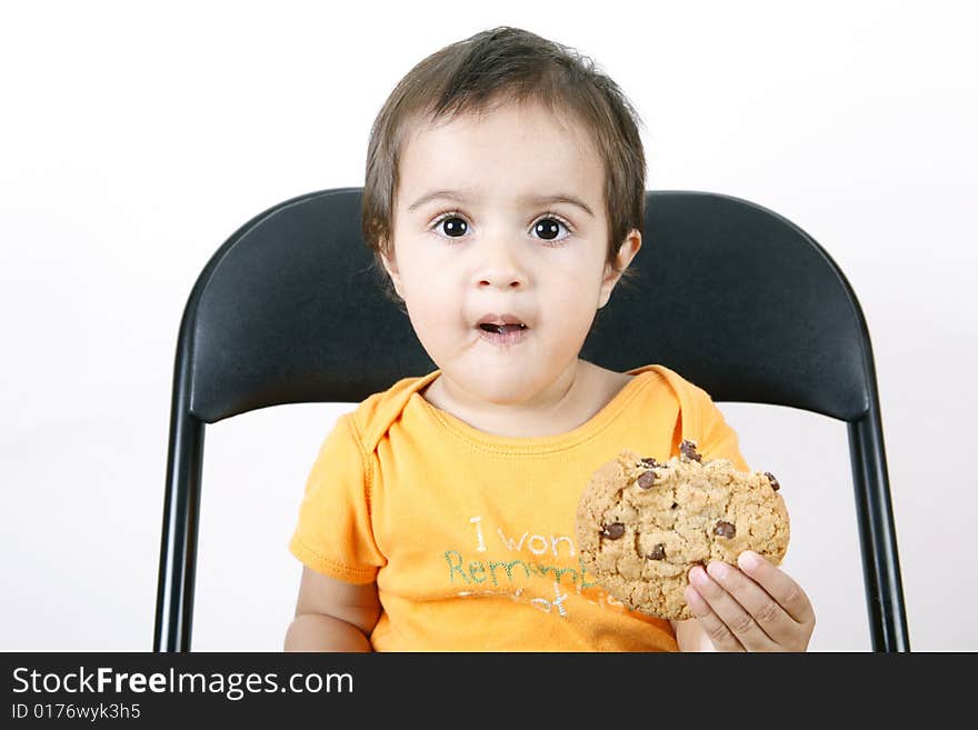 Small girl eating cookies