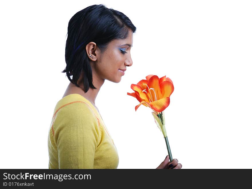 Picture of one girl and orange artificial flower on a white background. Picture of one girl and orange artificial flower on a white background