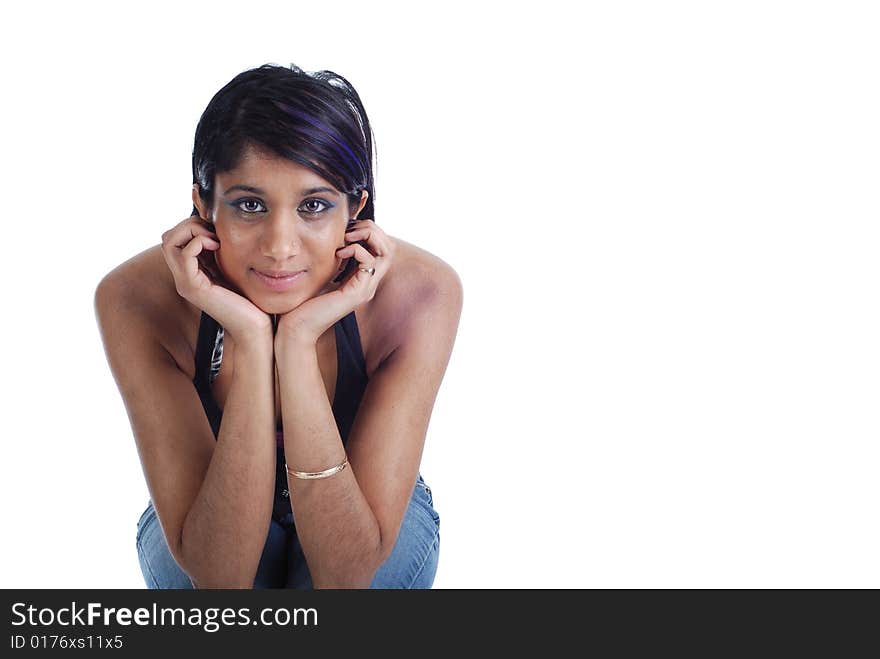 Picture of a girl sitting and looking at the camera. Picture of a girl sitting and looking at the camera