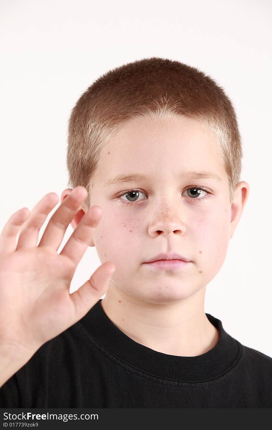 Young boy is preparing to say good bye. On white background. Young boy is preparing to say good bye. On white background