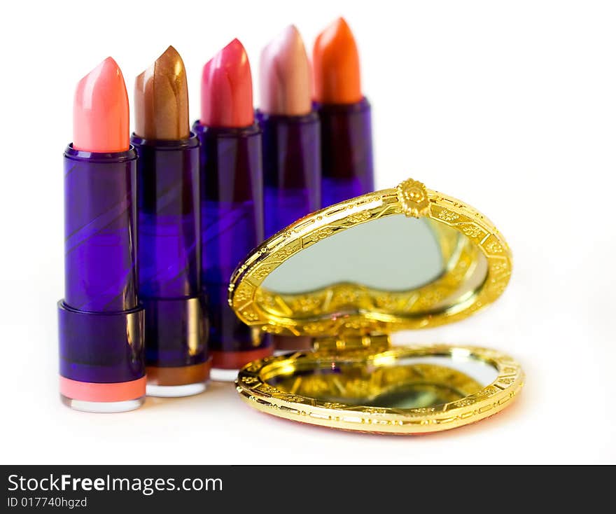 Five lipsticks and mirror