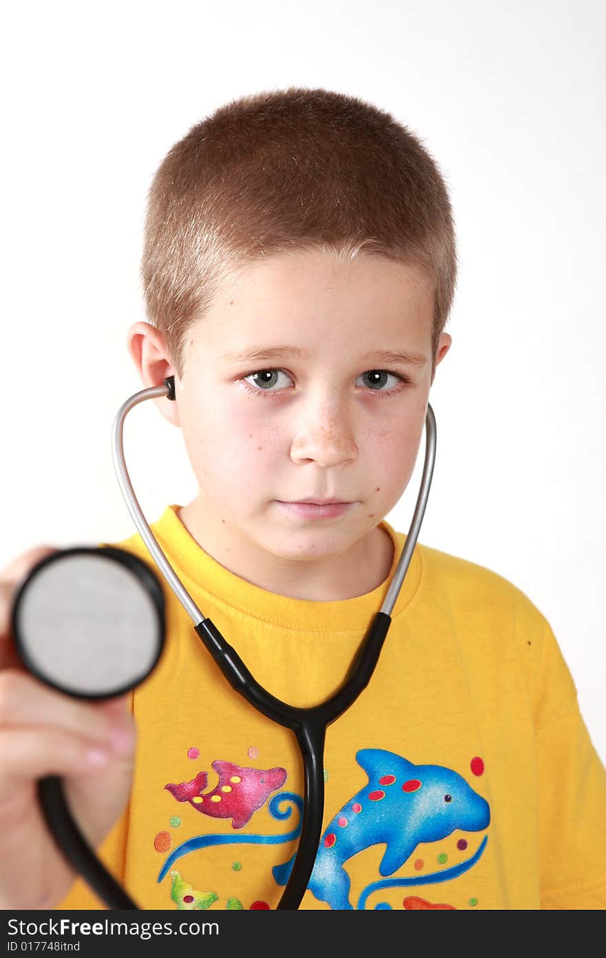 Young boy's direct look into camera with auscultoscope wearing. Young boy's direct look into camera with auscultoscope wearing