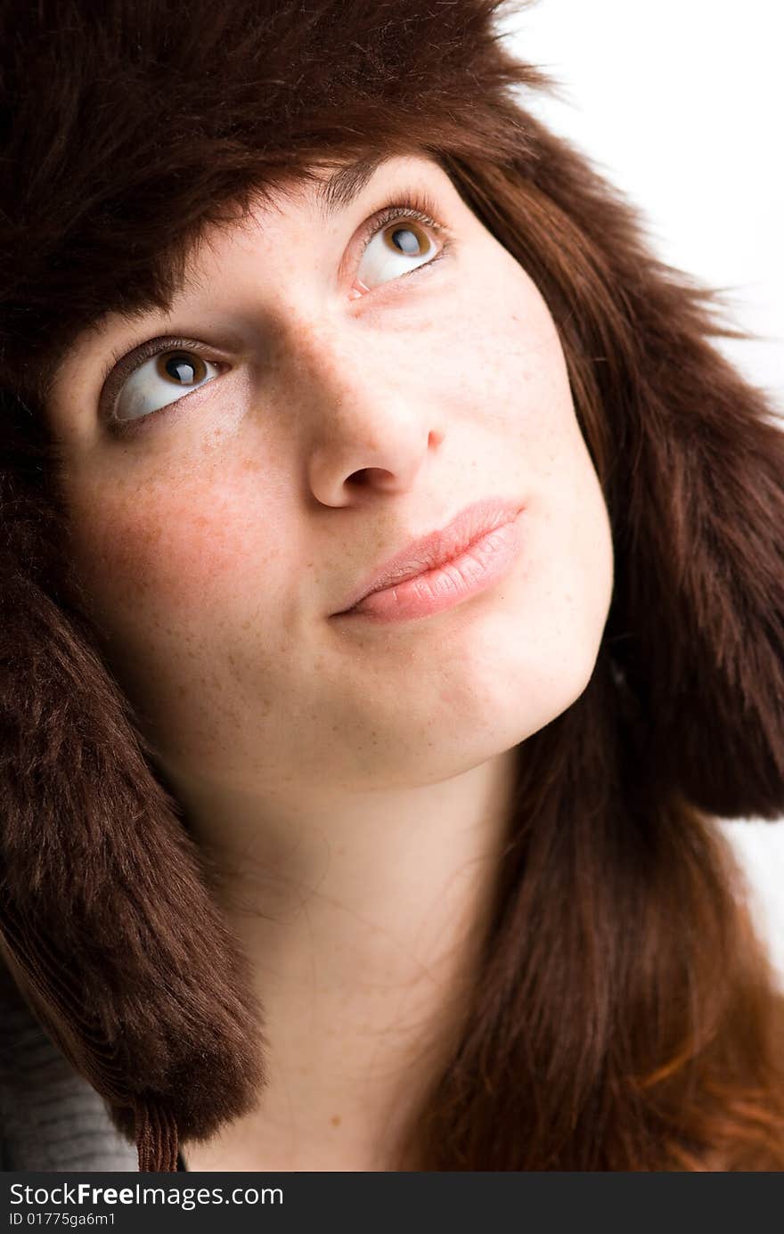 Woman, or teen in fall or winter hat.