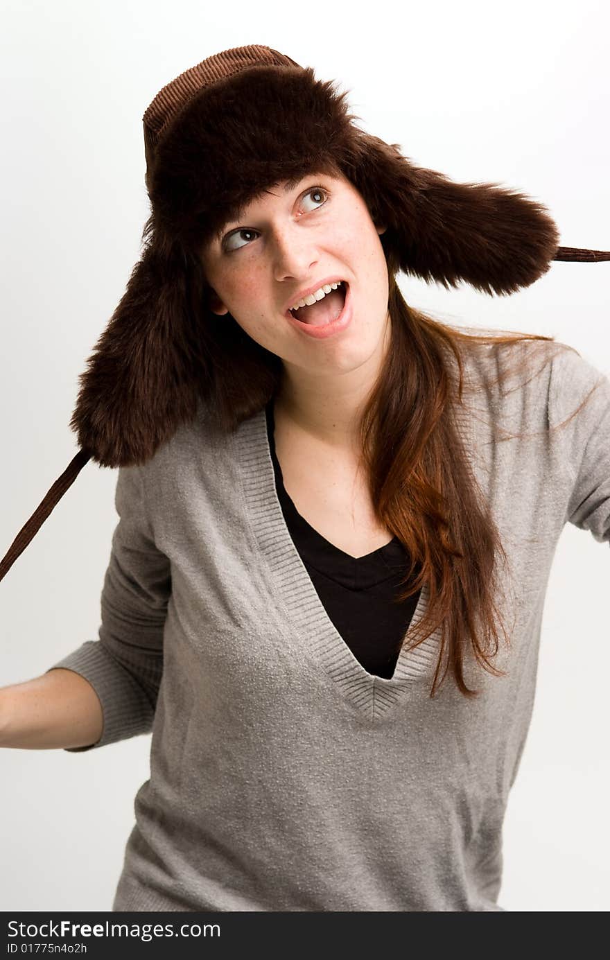 Woman, or teen in fall or winter hat.