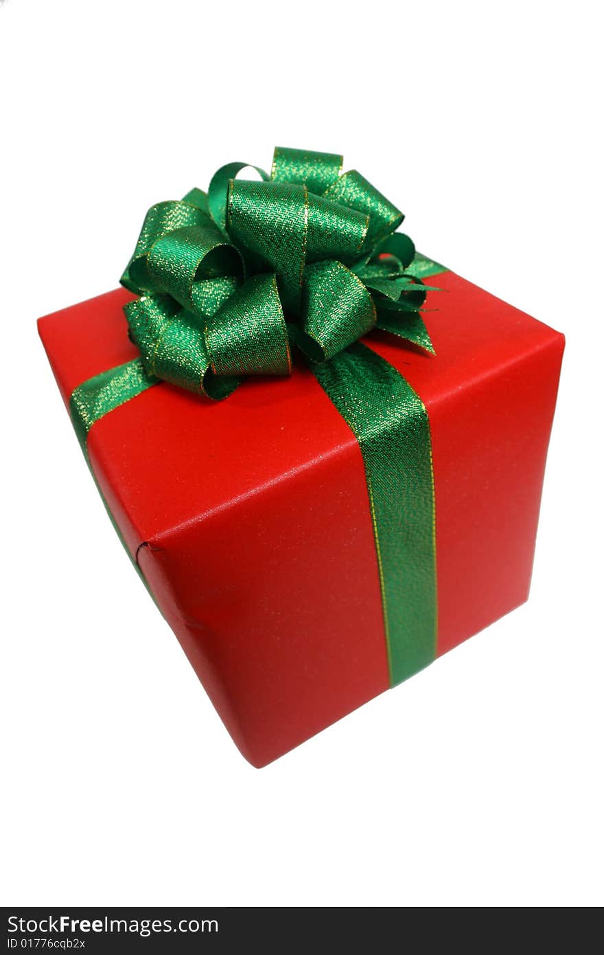 Gift wrapped in red with a green ribbon