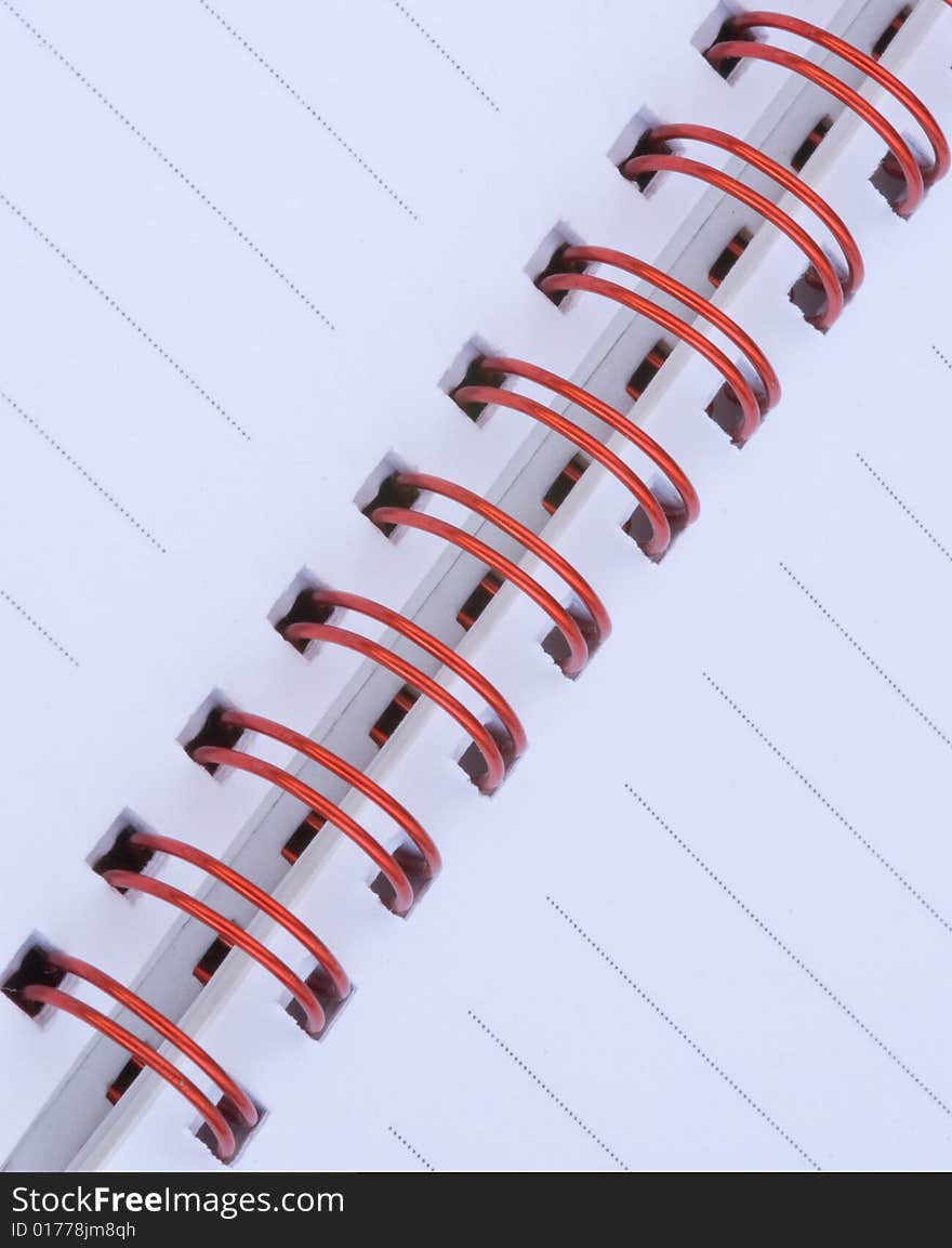 Notebook with red metal spiral. Notebook with red metal spiral