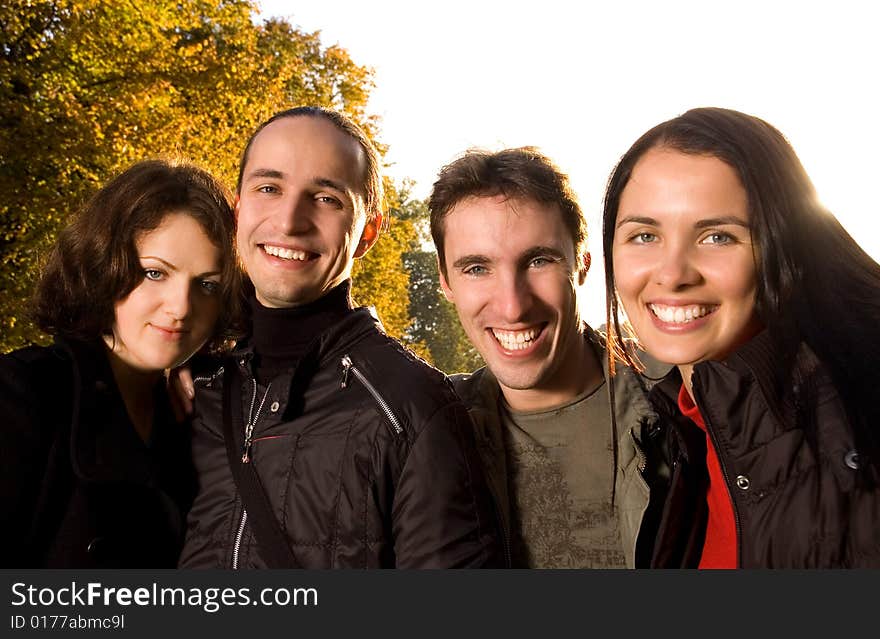 Friends having fun outdoors (autumn time)